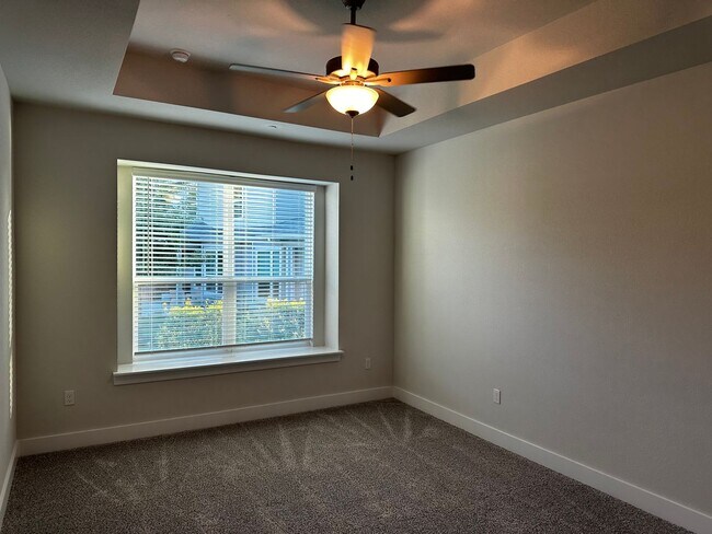 Building Photo - For Lease – Modern 2023 Condo Backing to Greenbelt | Creekside at Pioneer Crossing West