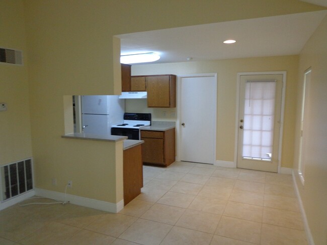 Building Photo - Charming condo features 2 bedrooms and 1 b...