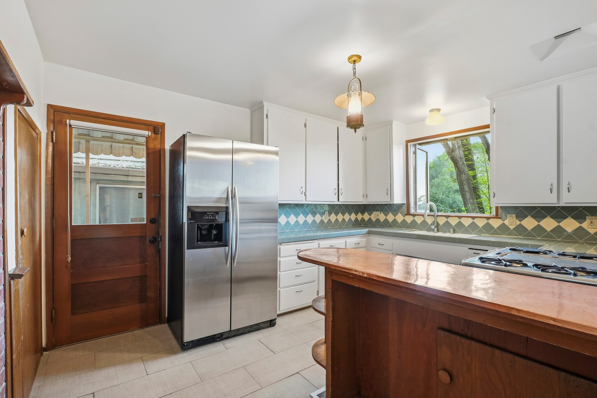 Kitchen Fridge and Back Door - 15135 Encanto Dr