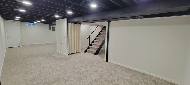 Partially finished basement with new carpeting, paint, trim, lighting and remodeled bathroom.. - 6305 49th Ave