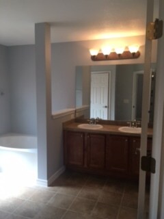 Master Bath. Also has separate shower. - 227 Woodsong Drive
