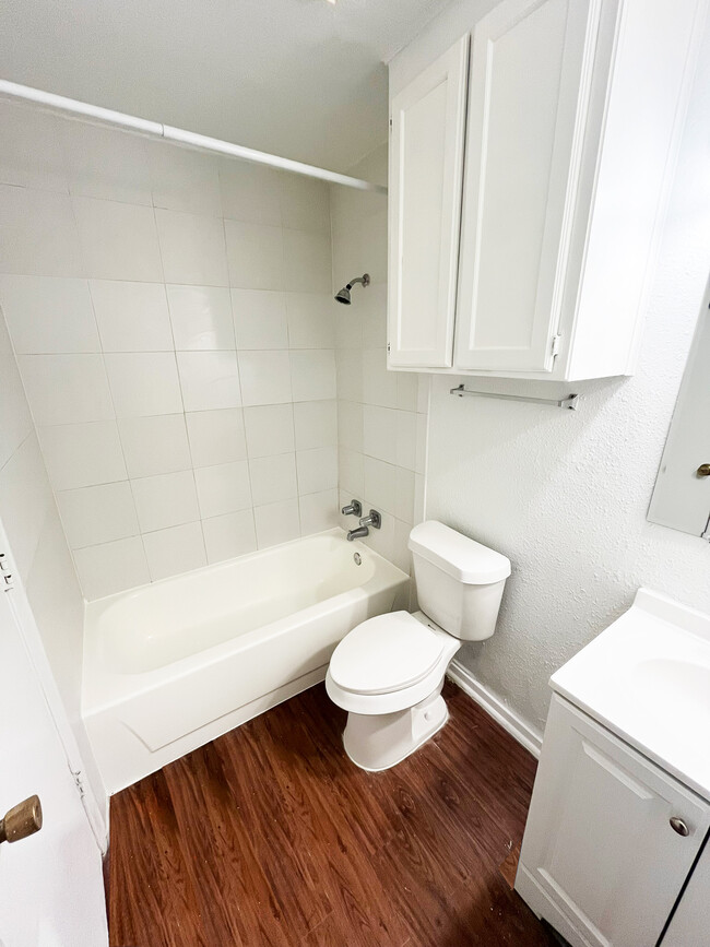 The bathroom is equipped with a bathtub combo with a shower, with multiple towel racks - 4917 Jamesway Rd