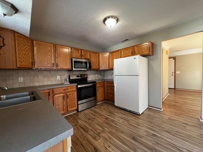 Building Photo - 6171 Womersley Dr
