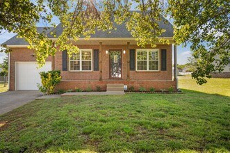 Building Photo - Charming Brick Home with Soaring Ceilings & Updated Finishes!