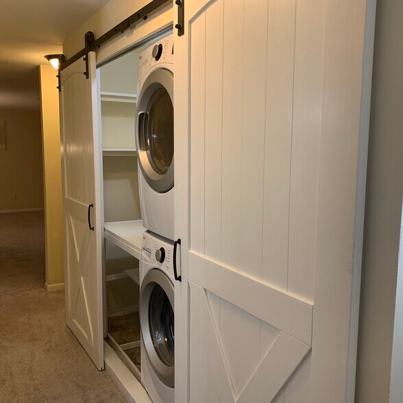 Newly renovated laundry room with brand new washer/dryer and custom built shelving - 1265 Woodmere Rd