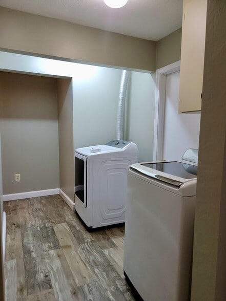 Hall with laundry (outside of bathroom) - 128 Malden St