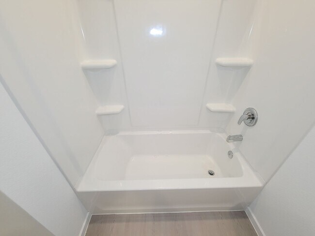 Building Photo - This great new single-story design makes smart use of the space available. At the front are all t...