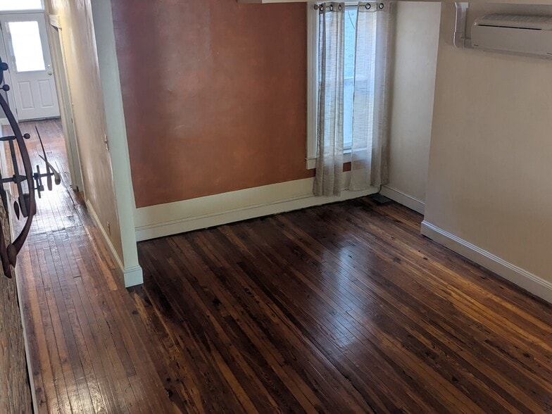 View from stairs to third floor looking into dining/living room - 2747 Maryland Ave