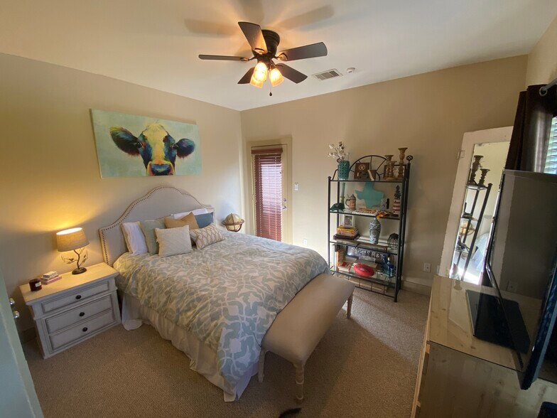 Downstairs secondary bedroom. Door to side patio. - 1728 W 25th St