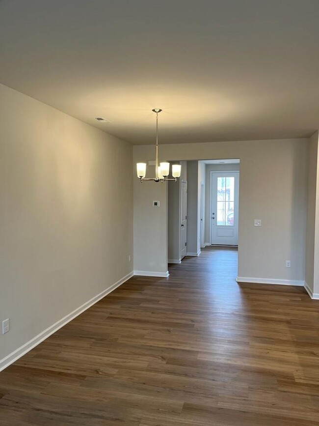 Building Photo - Townhome with 3BR/2.5BA Garage Located in ...