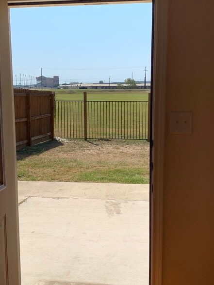 Fenced back yard with large patio and open field behind (no neighbors to stare at). - 16715 Jupiter Haven