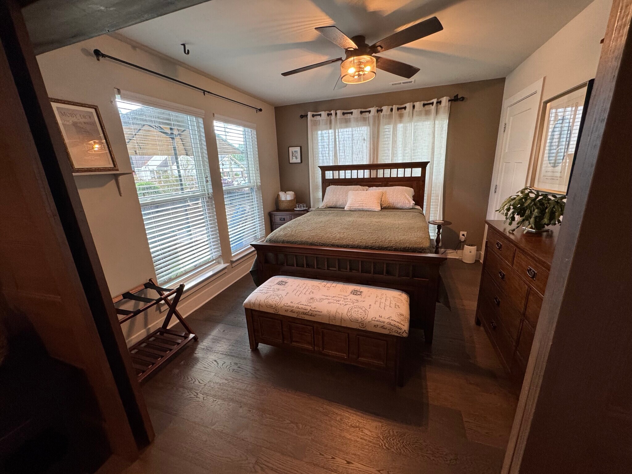 Third bedroom on bottom floor with custom wood sliding doors and full bathroom - 1547 Duckworth Ave