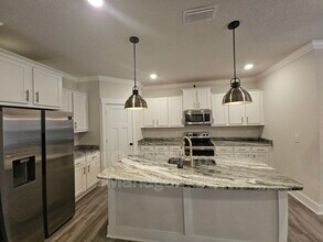 Building Photo - 6047 Twenty One Oaks Dr