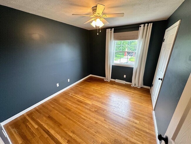 Building Photo - AVAILABLE NOW! Spacious 4 BR, 2 Bath House! Wood Floors, Attached Garage, W/D Included