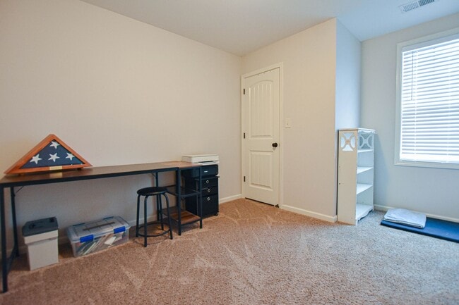 Building Photo - Pet Friendly Three Bedroom with Bonus!