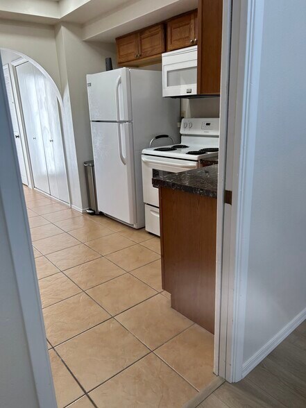 Kitchen w/ full size Refrigerator/Freezer - 440 N Dodge Blvd