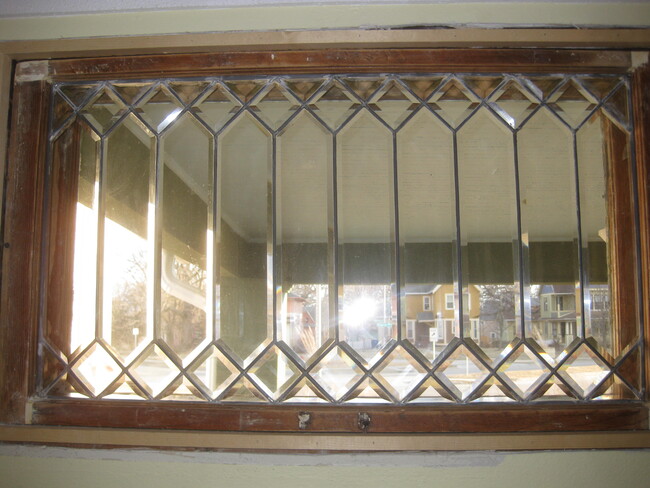 ornate leaded glass overlooks the front porch - 2415 Cottage Grove Ave