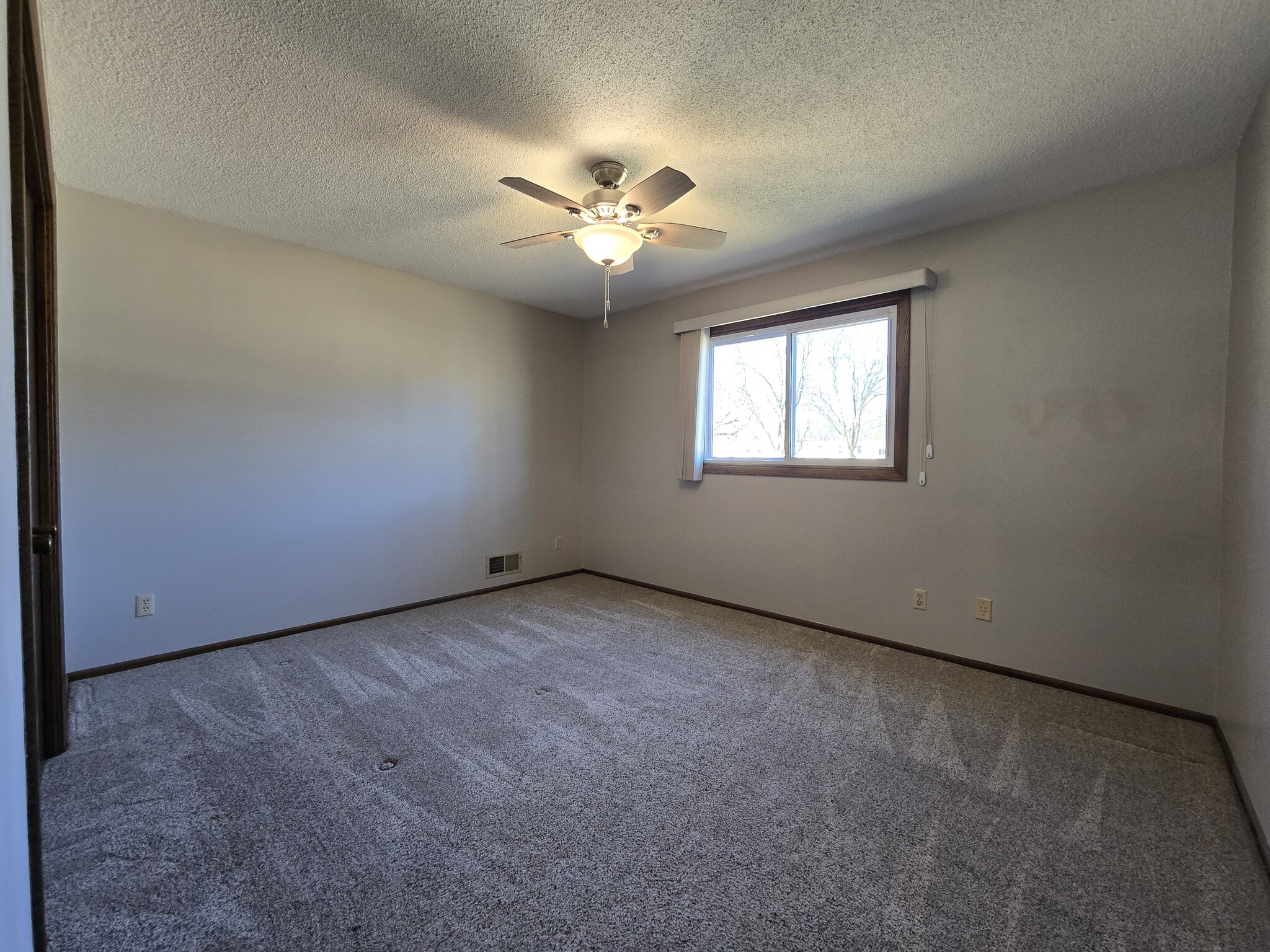 Master bedroom with ceiling fan - 775 Madson Ave SW