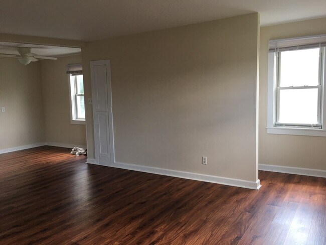 Living room view into dining room - 6004 Old Capitol Trl