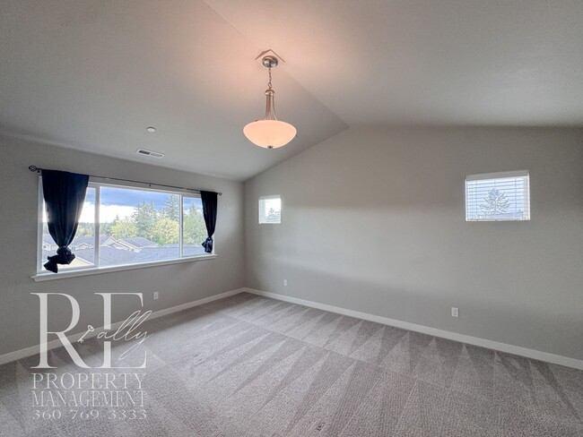 Building Photo - Vaulted Ceilings, Tree-Lined Views & a Spacious Primary Suite Retreat