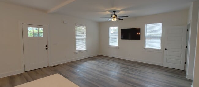 Building Photo - 5-bedroom home with 3 car garage and fully...