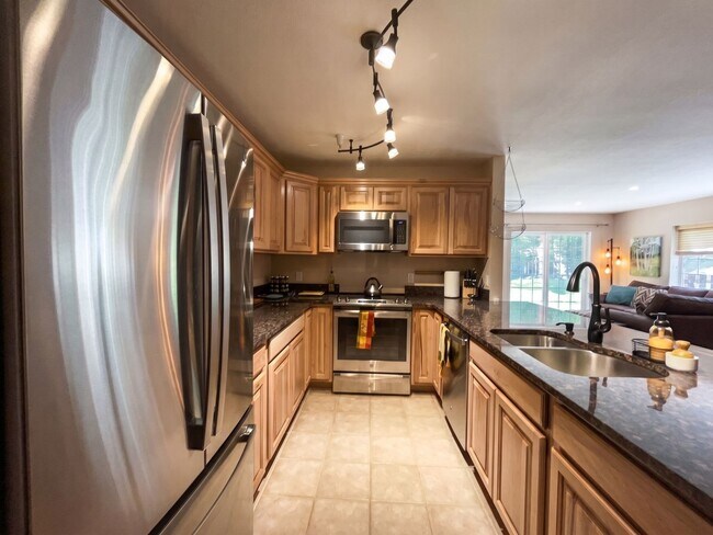 Building Photo - Two-Bedroom Condo with Attached Garage, Available Now
