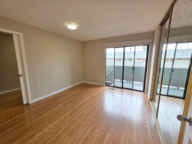 Building Photo - Spacious 2BR Condo with Central A/C, Bonus Room & Huge Storage – Walk to Burlingame Avenue