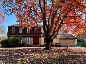 Building Photo - Beautiful and updated 4 BR 2.5 BA with garage and lovely yard!