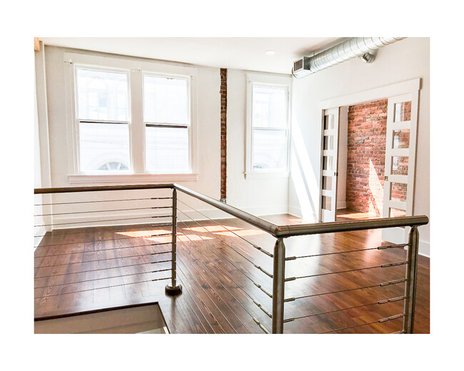 Beautiful light when you come up the stairs into the living area. - 18 W State St