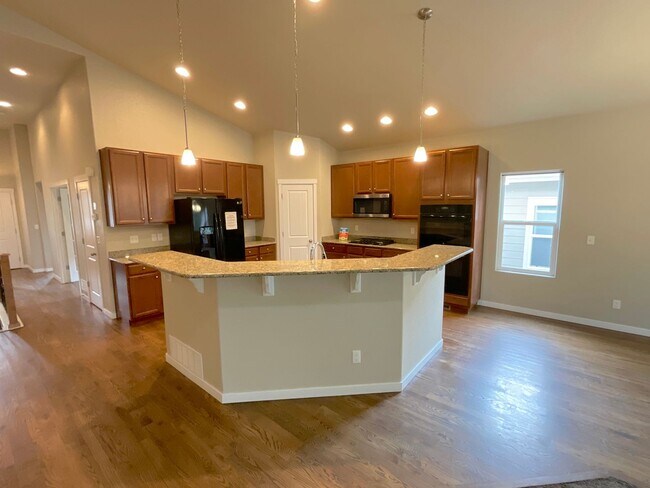 Building Photo - 4 Bedroom Home Available Near Woodmoor Dr ...