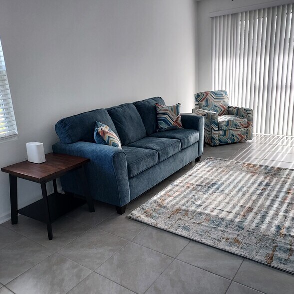Living area and screened in lanai - 67 Sage Branch St