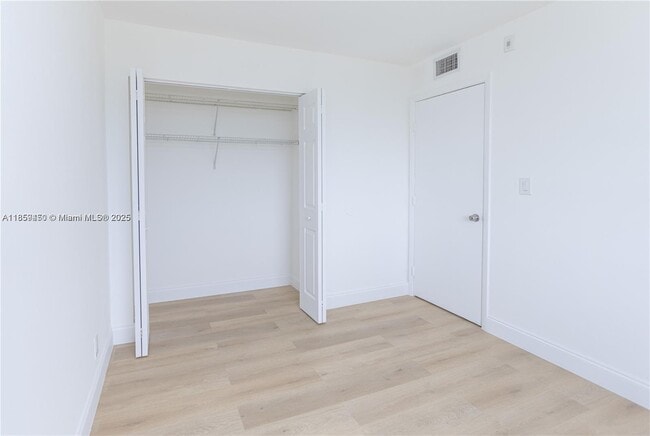 Building Photo - $2,100MONTHLY;8740 N SHERMAN CIR. #408 MIR...