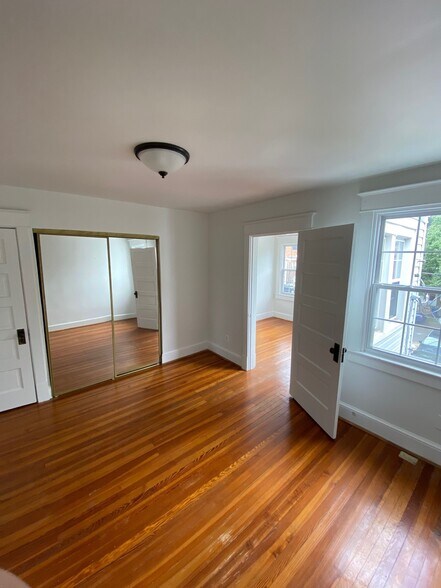 Rear Bedroom wiht door to Bedroom 3 - 112 N Peyton St