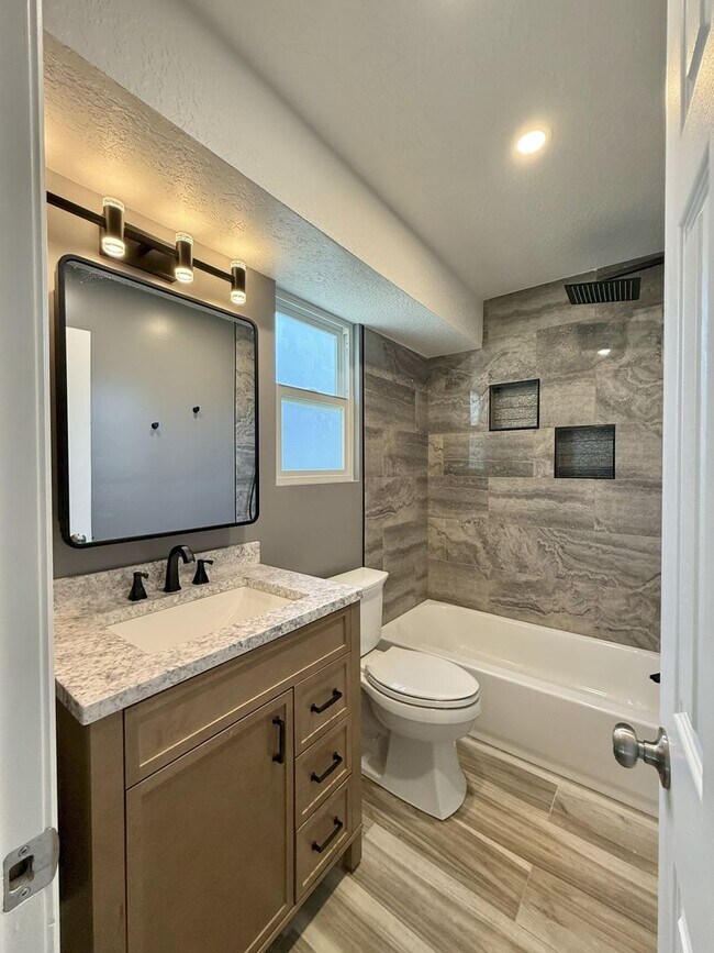 Building Photo - Spacious Comfort Meets Practical Living in...
