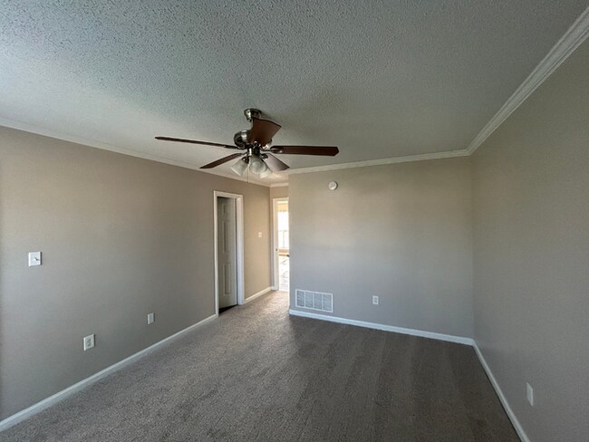 Building Photo - Spacious 4BR/2BA Olive Branch Home | 1,965 Sq Ft, Modern Fireplace, Bay Window & 2-Car Garage