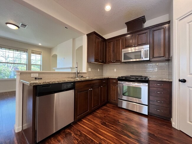 Building Photo - 3BD/3BA Bethany Home with Vaulted Ceilings, Stainless Appliances & Gas Fireplace