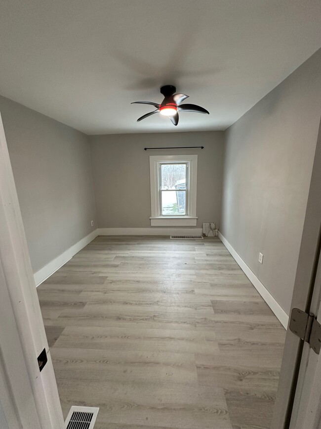 Bedroom off of dining room. - 8215 Lake Pleasant Rd