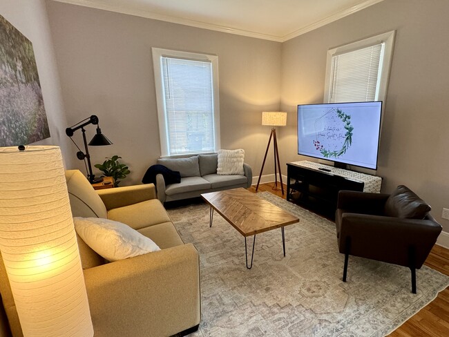 Lots of natural light in living room. - 189 Newton St