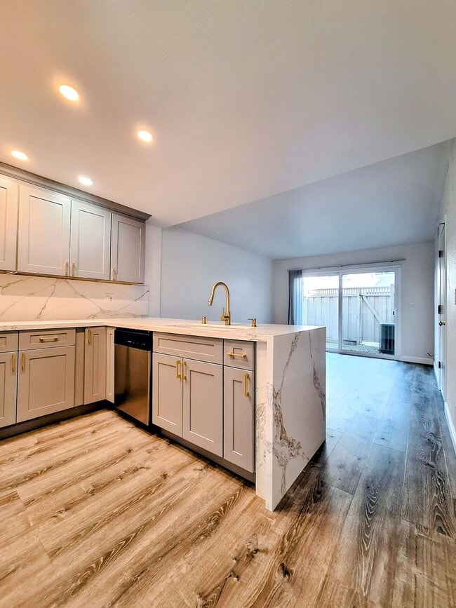 Building Photo - Spacious Two-Story 3bd Townhouse With Private Patios, Balcony, & Garage