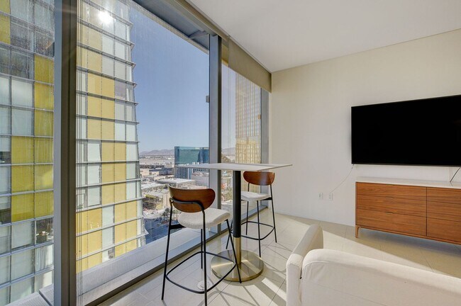 Building Photo - Stunning Strip Views from this Fully Furnished Studio Residence.