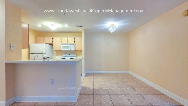 Building Photo - MOVE IN READY! LARGE 2 BEDROOM/2 BATH PLUS ATTACHED GARAGE! TILE/LVP THROUGHOUT!