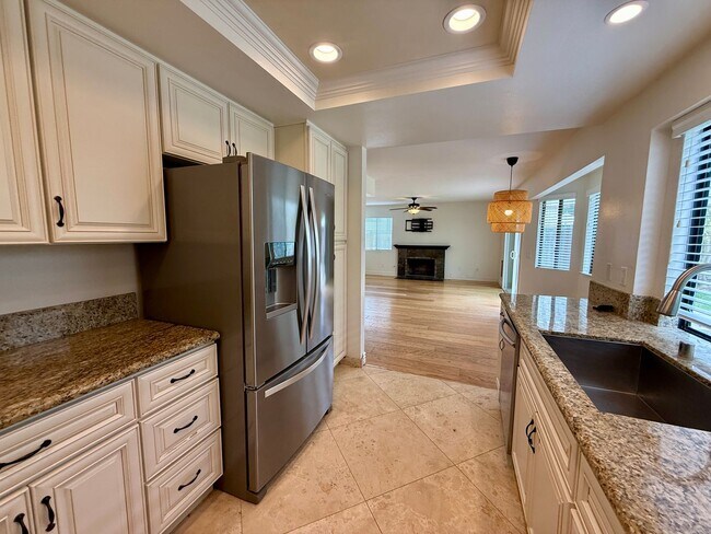 Building Photo - Spacious 4 Bedroom House with Large Fenced Yard! Landscaping Included! Two Car Garage!