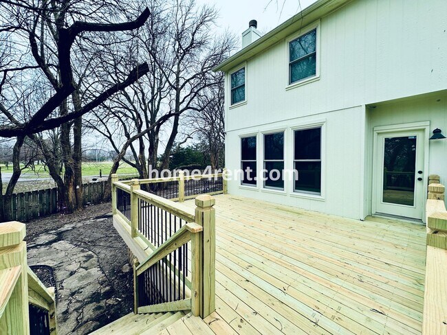 Building Photo - Blue Valley Schools w/ Wood Floors, Finished Basement and a Peaceful, Private Fenced Yard!