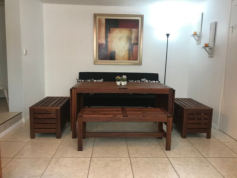 Dining room with extra storage banches - 2440 Manasota Beach Rd