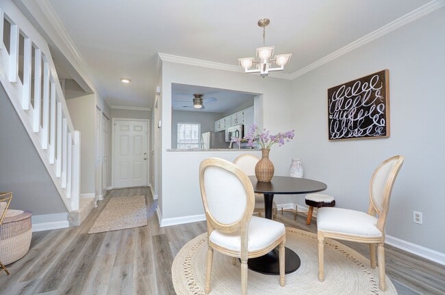Building Photo - Discover this beautifully updated Raintree townhome featuring an open floor plan and a range of c...