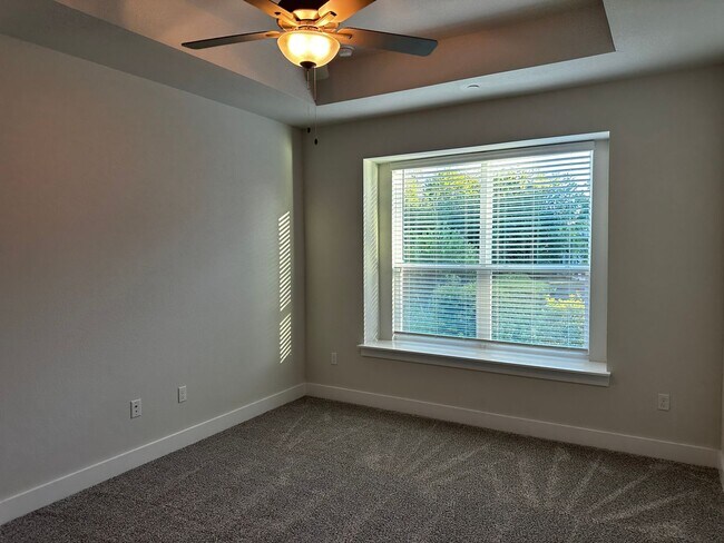 Building Photo - For Lease – Modern 2023 Condo Backing to Greenbelt | Creekside at Pioneer Crossing West