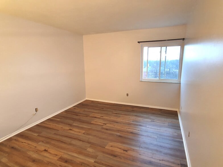 Bedroom 1 that has a walk-in closet - 20333 Detroit Rd