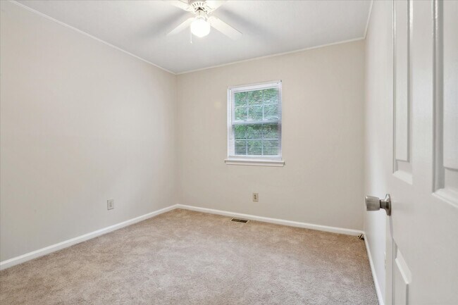 The home offers three spacious bedrooms! - 1644 Skiffes Creek Cir
