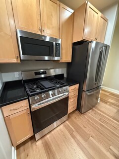 NEW GE kitchen appliances including fridge, oven and stove, microwave, and dishwasher - 1925 N Water St