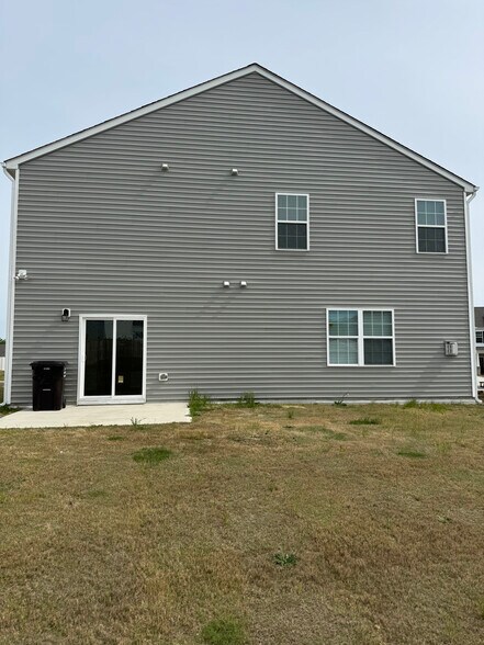 Open back yard with patio - 406 Blue Aspen Dr